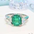 The Cushion Emerald & Diamond Three Stone Ring