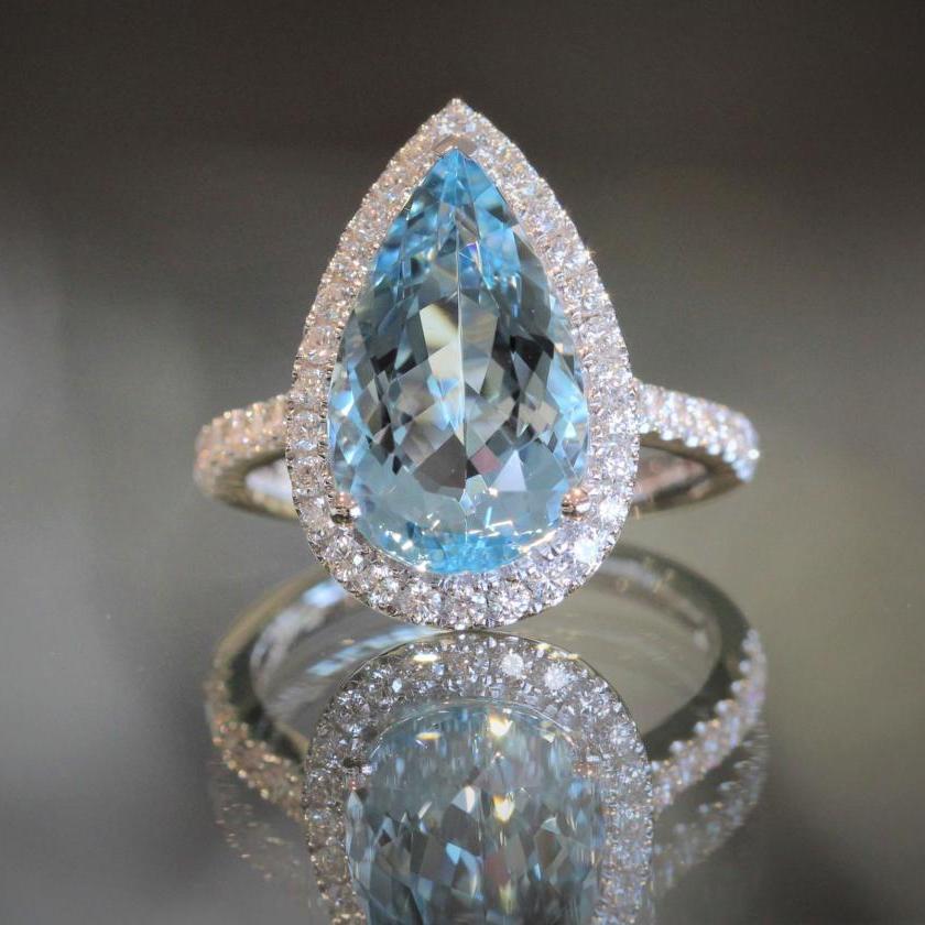 18ct White Gold Aquamarine and Diamond Halo Ring