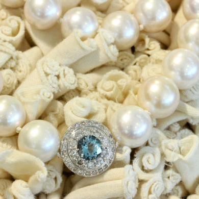 The 18ct White Gold White Cultured Pearl, Aquamarine and Diamond Strand